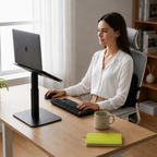 Woman working at a desk with a laptop and keyboard in a home office setting.