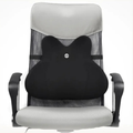 Black massage pillow on a gray office chair with a white background